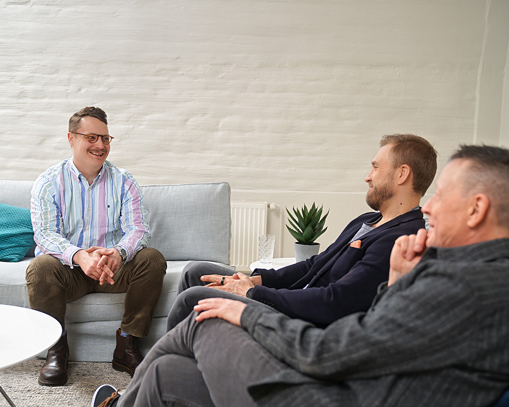 Iiro, Matti and Juhani from Prohoc sitting and talking